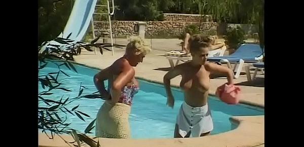  Two guys watching two lesbians in a pool, getting aroused